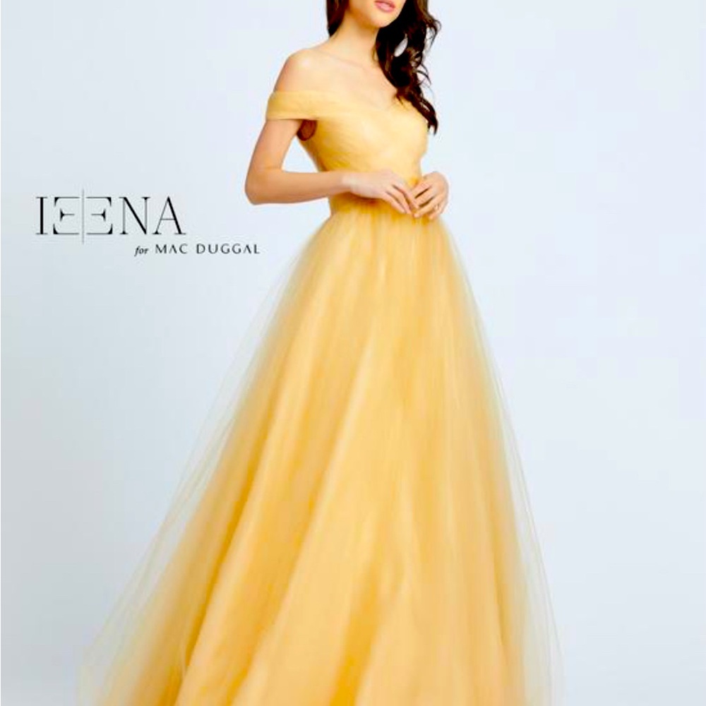 MAC DUGGAL 
The champagne dress offers and off the shoulder neckline